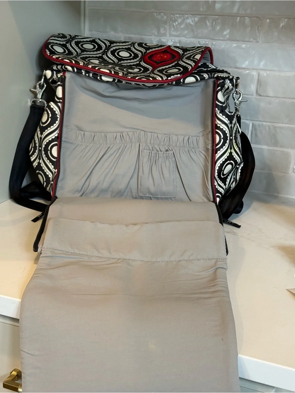 Petunia Pickle Bottom Black & White Geometric Baby Bag with Red Accent